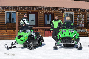 snowmobilers take a break