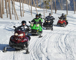 Snowmobiling along a groomed path