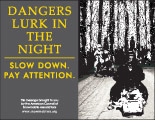 Horizontal Poster of Snowmobilers and text ‘Dangers Lurk In The Night. Slow Down. Pay Attention'